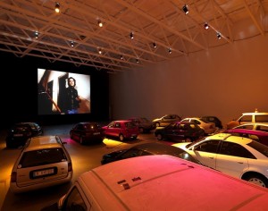 Installation view of Phil Collins's Auto-Kino! (2010)